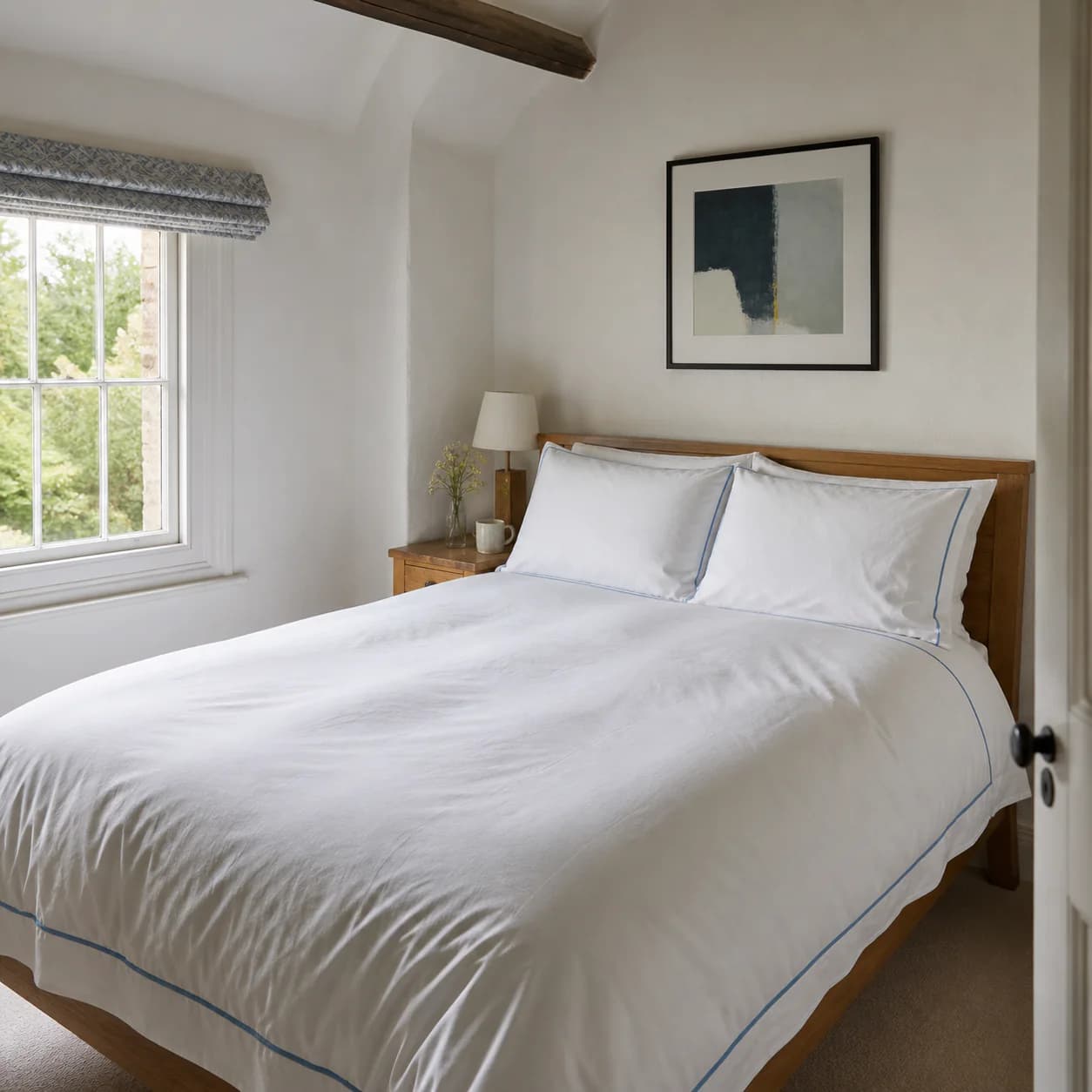 A holiday let bedroom made up with freshly pressed bed linen