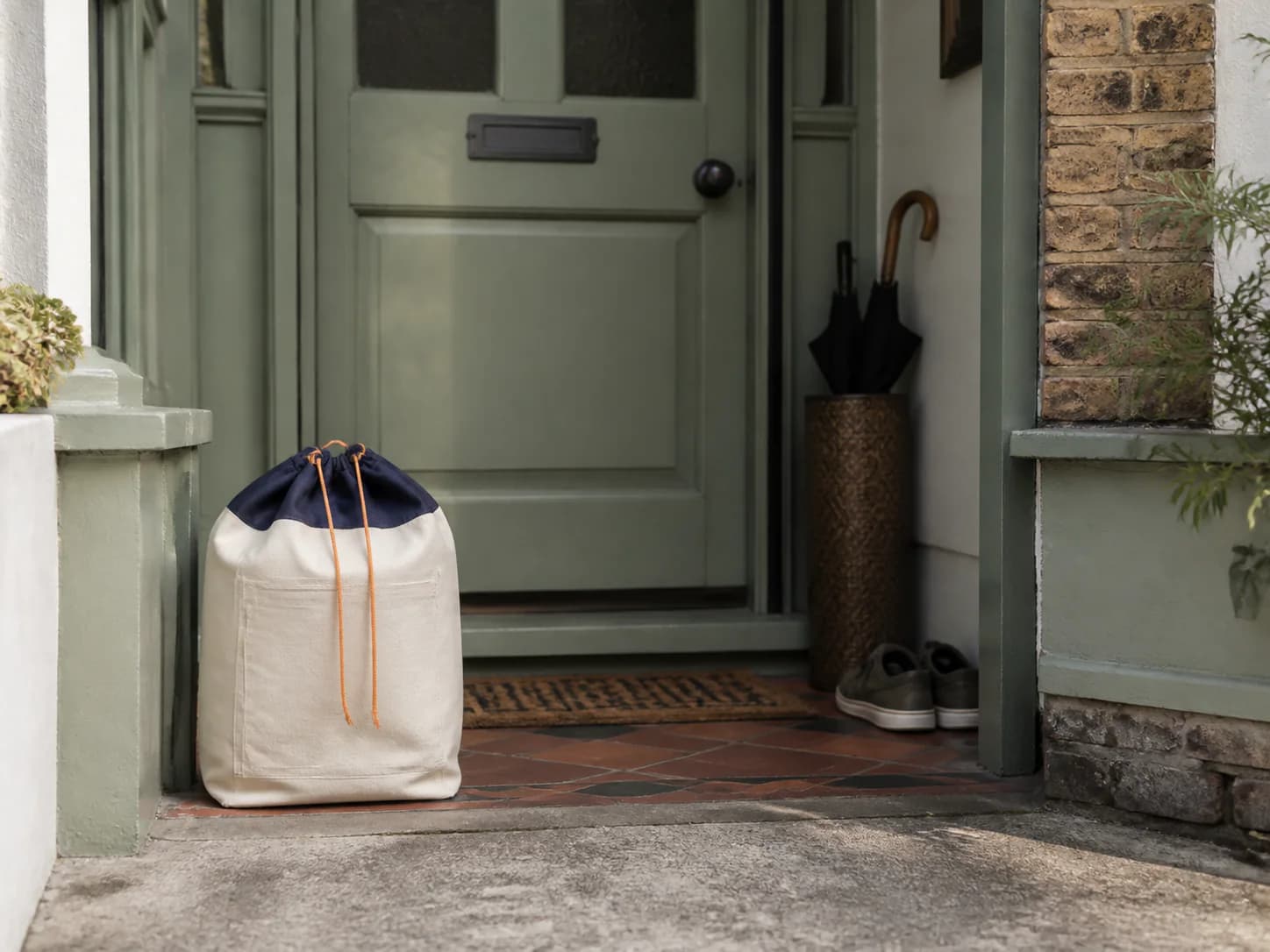 A laundry bag packed and left ready in a porch for collection