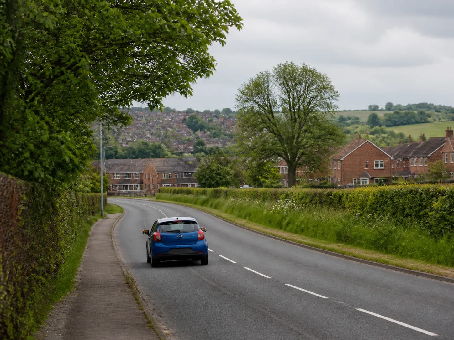 The blue collection car on a local road at the edge of Methley