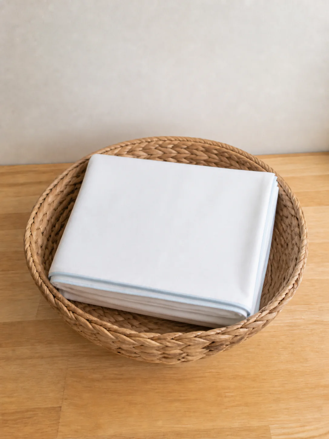 The same duvet cover pressed flat and folded into a neat square