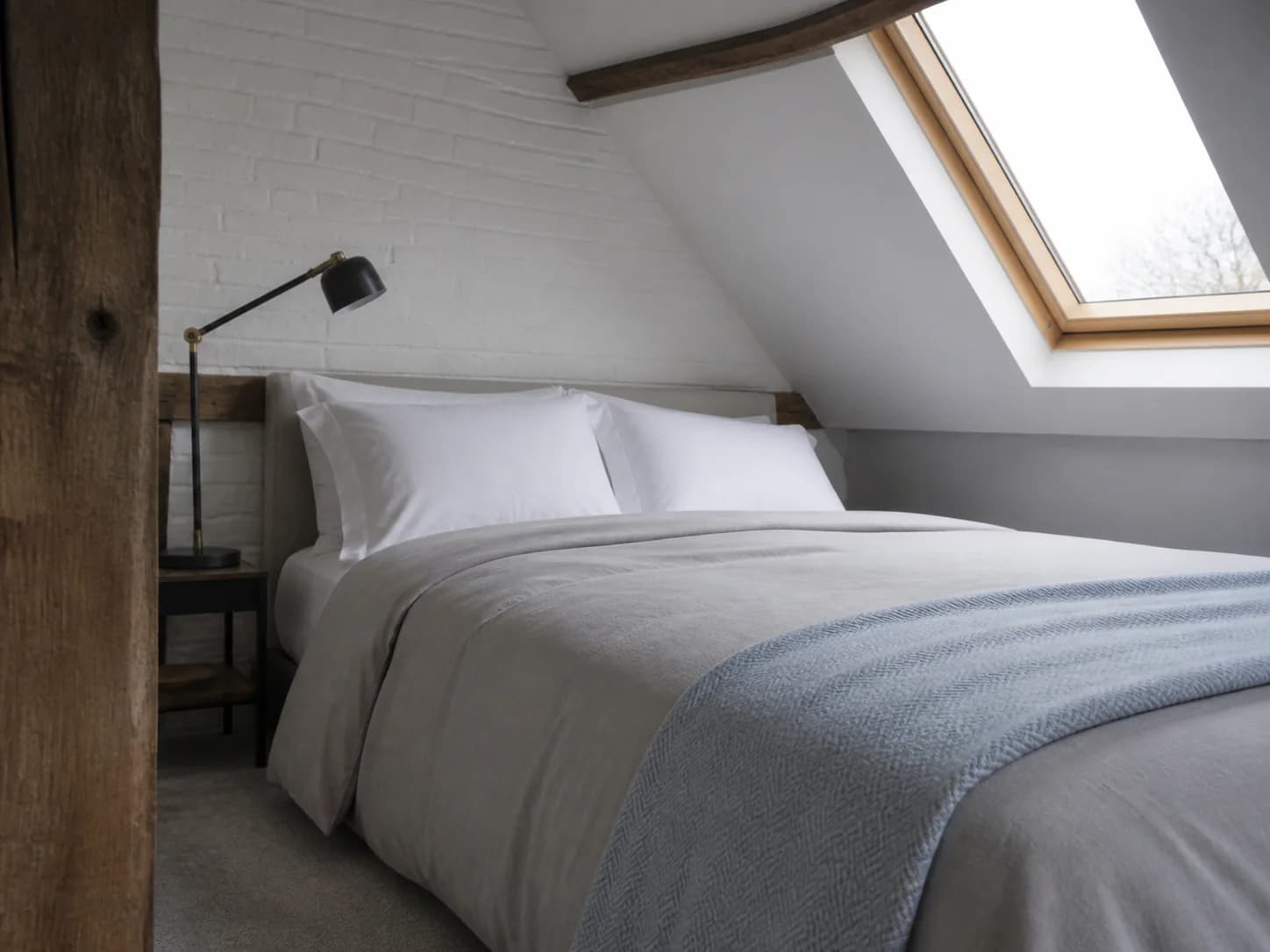 A guest bed made up with freshly pressed linen in a holiday let
